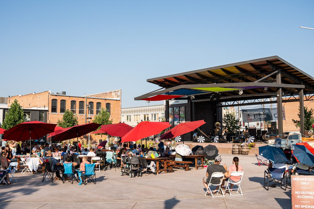 market gathering with a grandstand and a band playing
