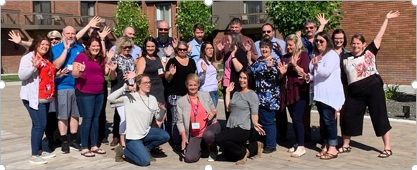 large group of people attending a conference posing for a group photo